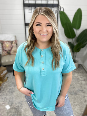 In the Rotation Exposed Seam Tee in Aqua